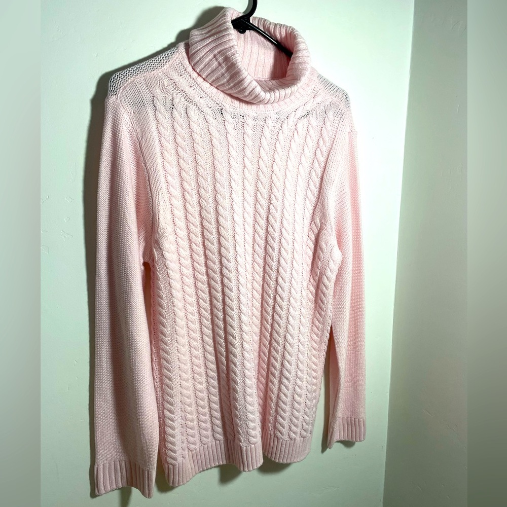 Pink cowl neck, cable knit sweater.